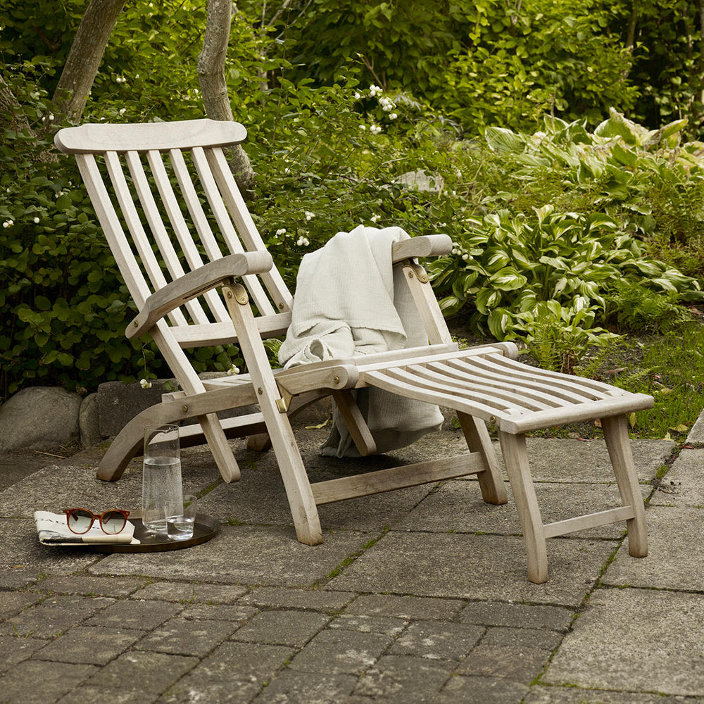 A teak sun lounger